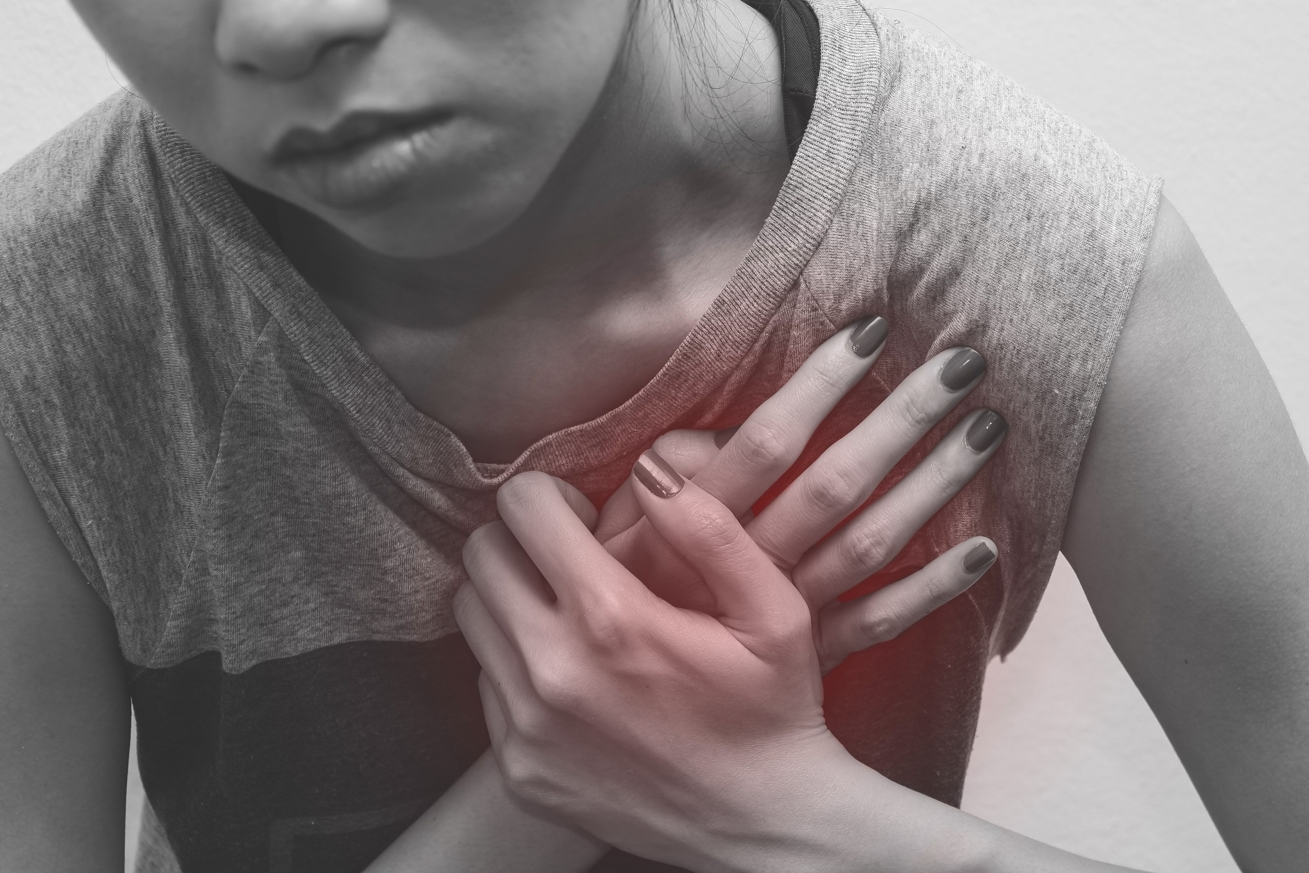 woman chest pain, monochrome